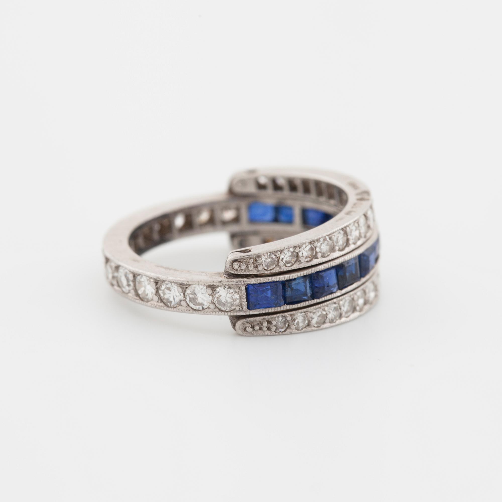 A square cut sapphire and single cut diamond ring.