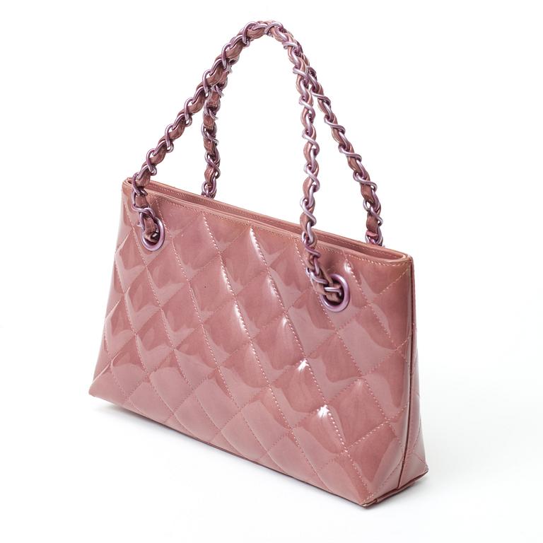 A quilted patent leather handbag by Chanel.