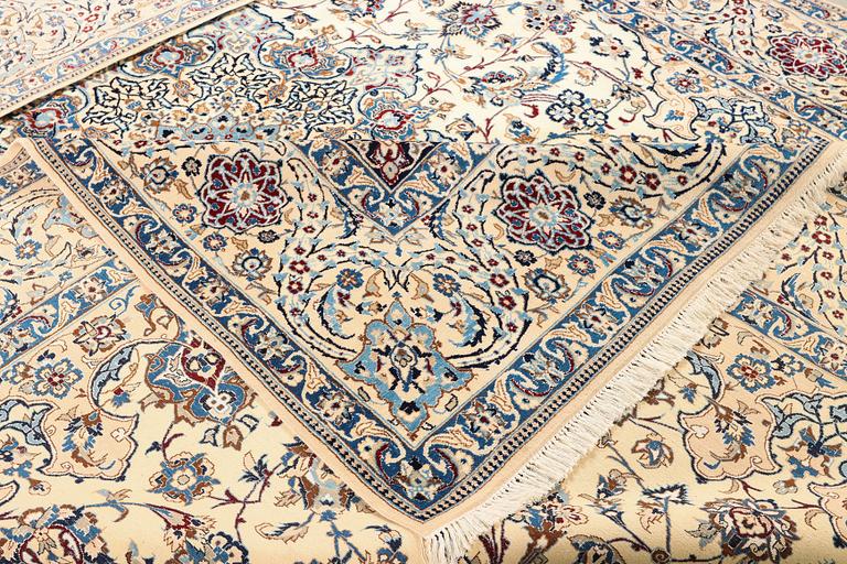 A Nain, part silk carpet, c. 474 x 322 cm.