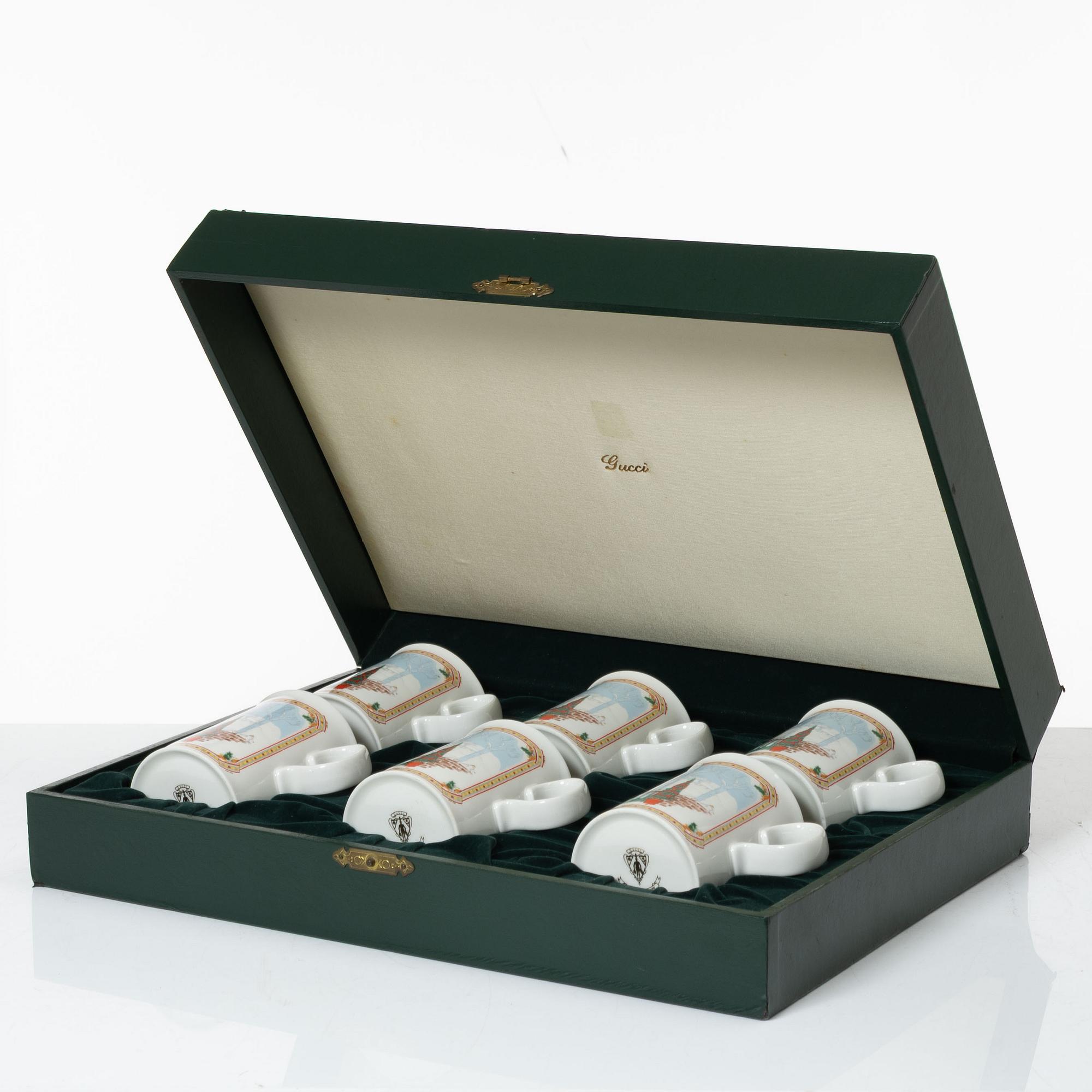 Gucci, A set of six vintage christmas mugs.