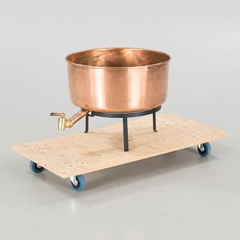 A copper vessel with tap, 20th century.