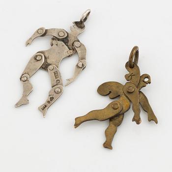 Two pendants, silver and yellow metal.