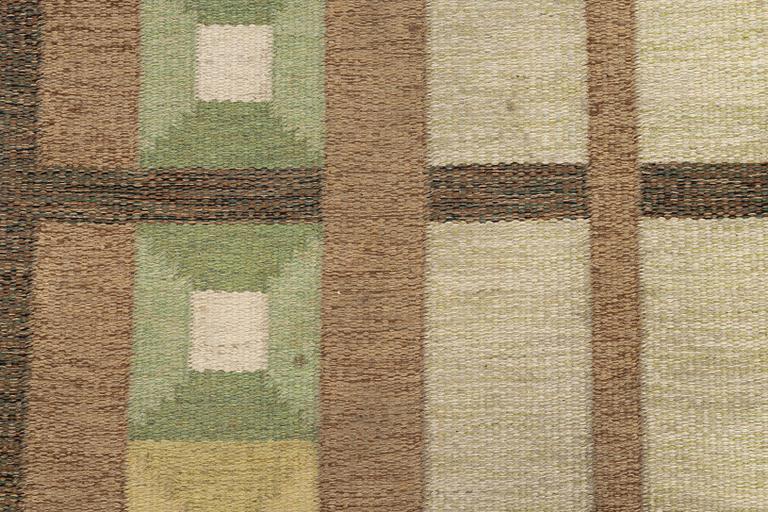 A flat weave carpet, signed, ca. 243 x 165 cm.