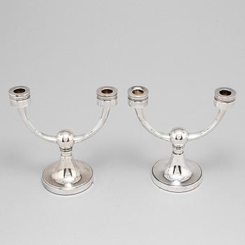A pair of silver candelabra from MGAB, Uppsala, 1969-71.