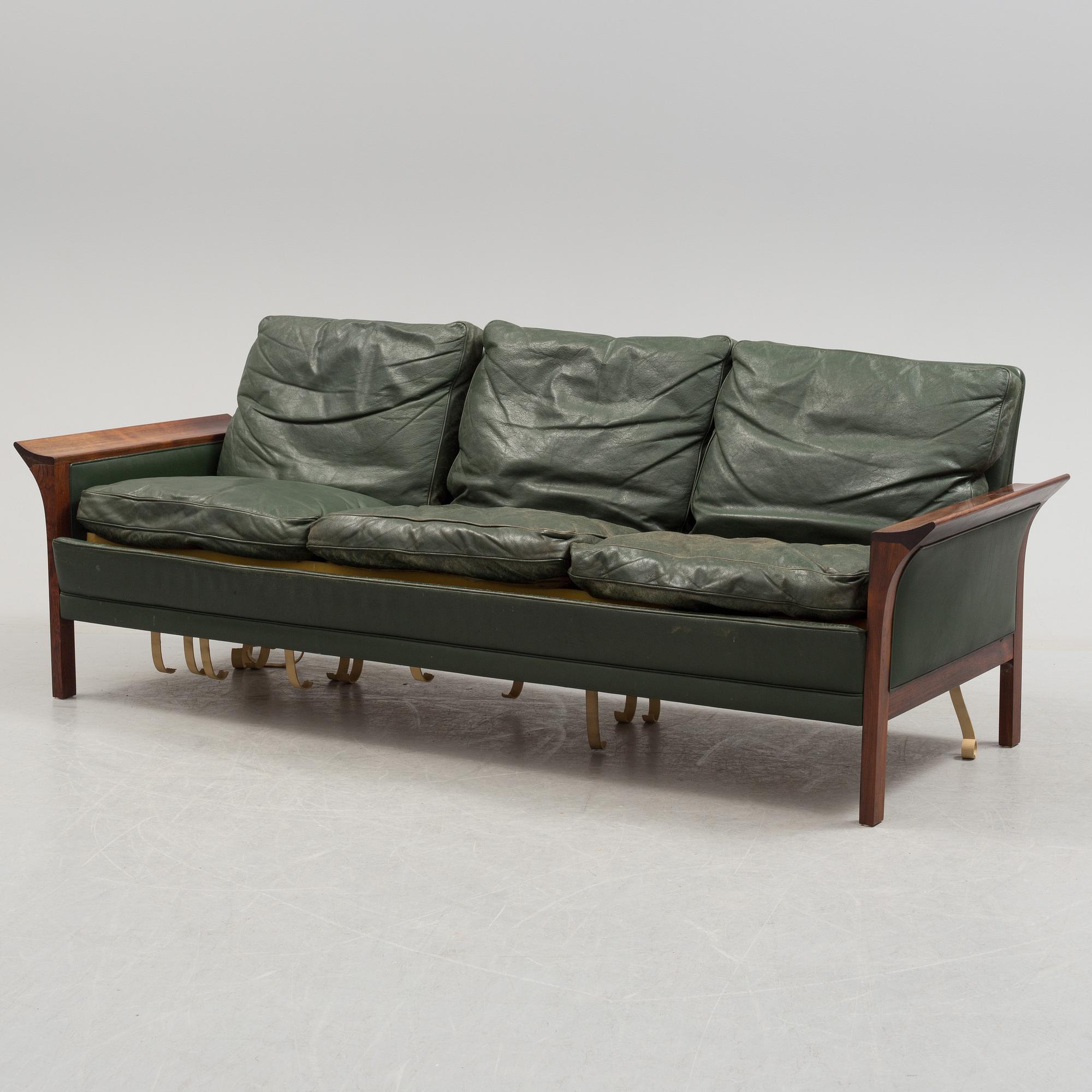 A 1960's Danish sofa, with 2 easy chairs and 2 tables by Glostrup.