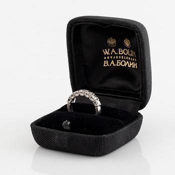 A WA Bolin 18K ring set with round brilliant-cut diamonds.