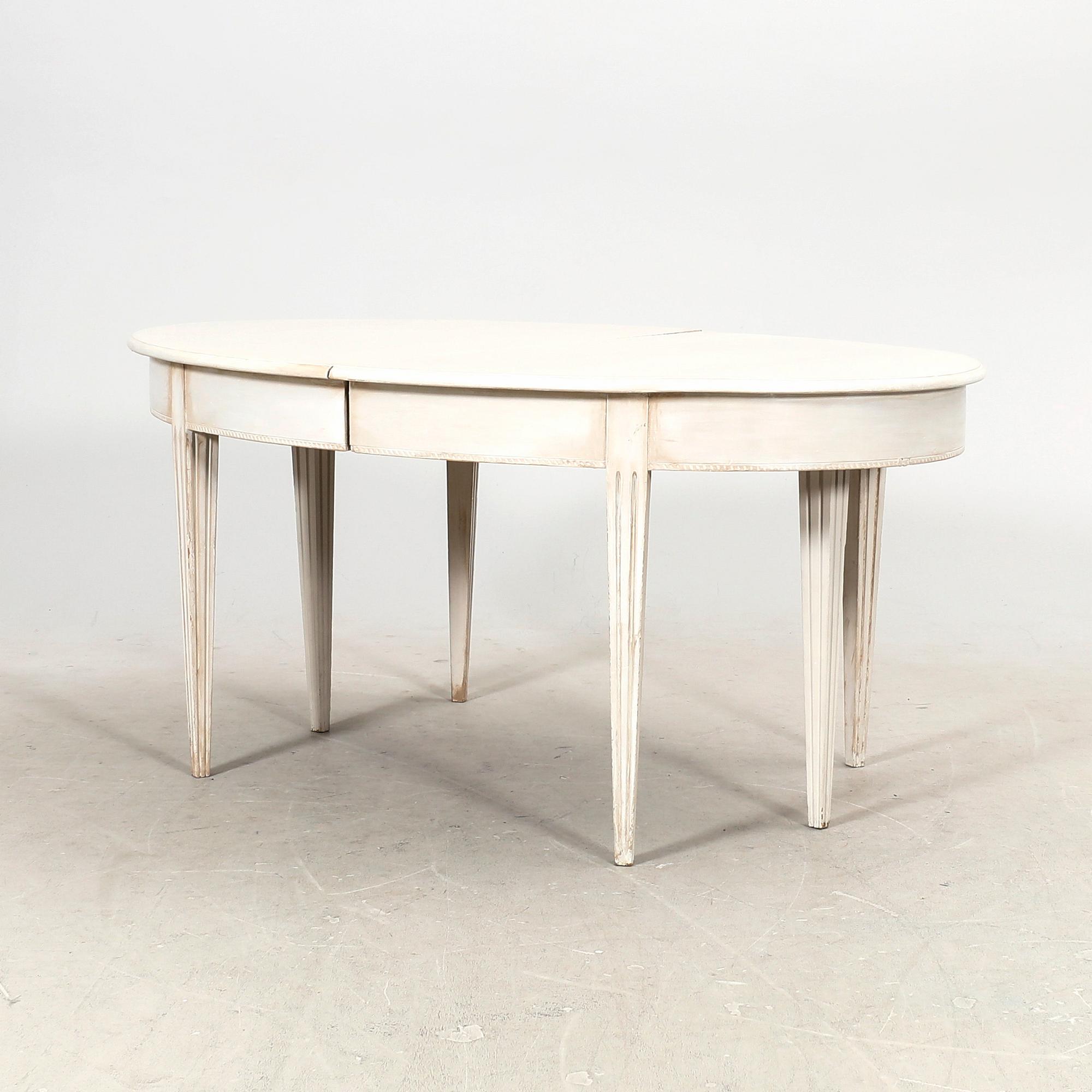 A painted 19th/20th Gustavian style dining table.