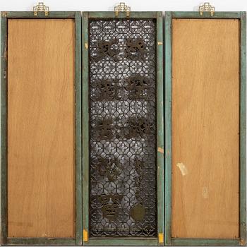 Three Chinese wooden wall panels, 20th century.
