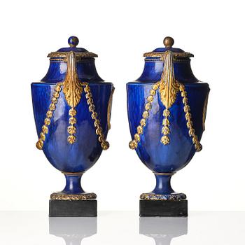 A pair of Swedish cream ware 'pistol handle' jars with covers, 1790's.