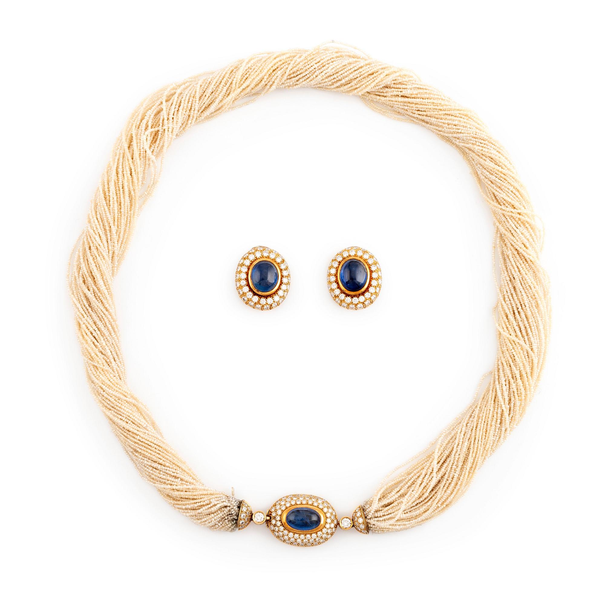 A multi strand seed pearl necklace and a pair of earrings. Bukowskis