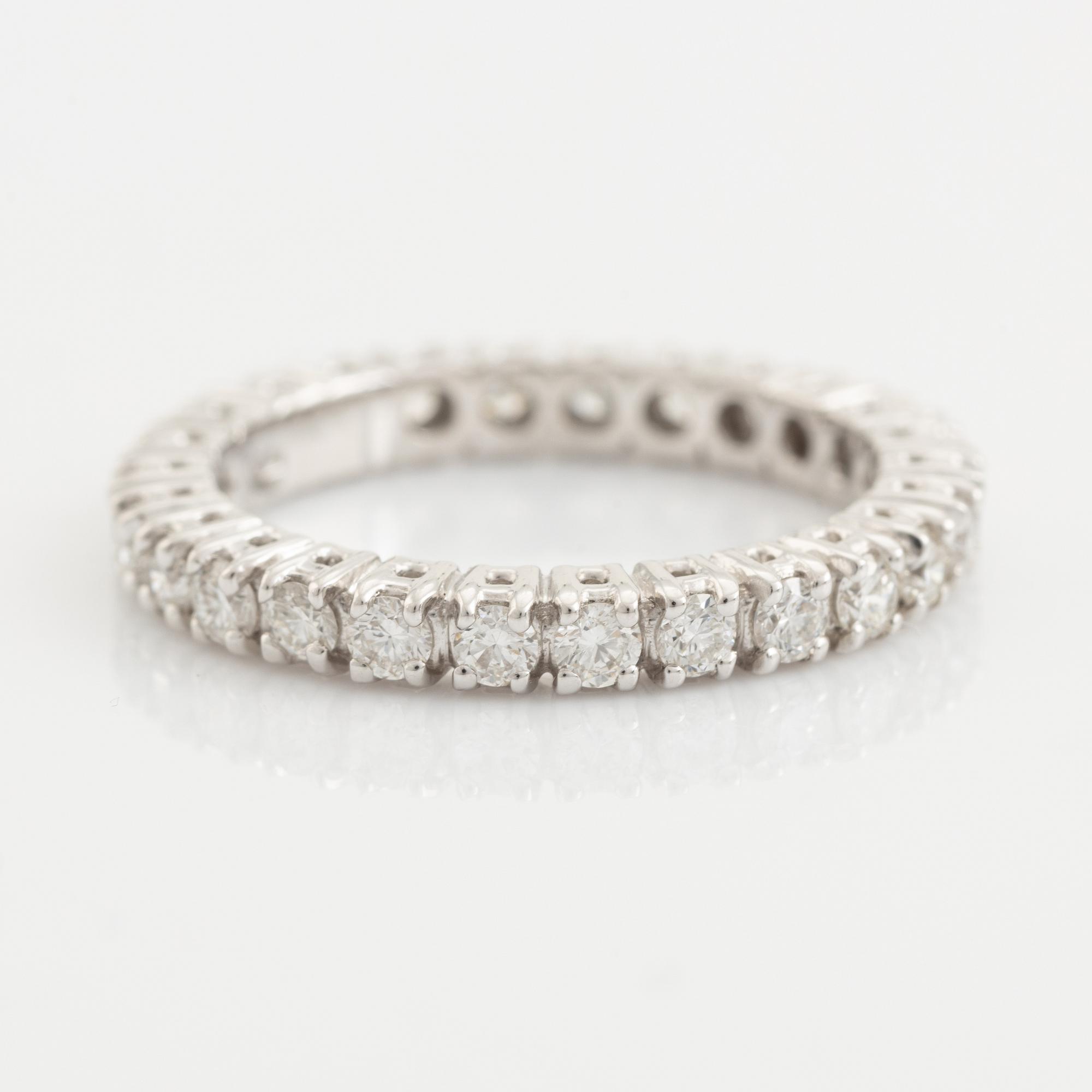 Brilliant cut diamond eternity ring.