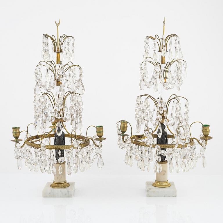 A pair of late Gustavian style girandoles, from around the year 1900.