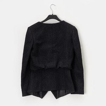 Chanel, A black bouclé jacket, size 34.