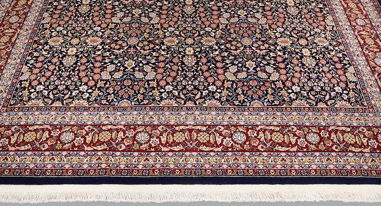 A signed Hereke carpet, ca 340 x 246 cm.