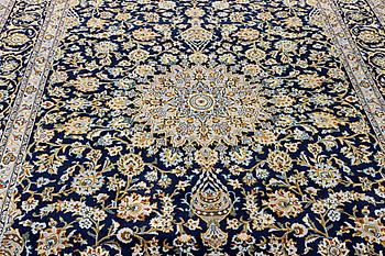 A Kashan carpet, c. 343 x 236 cm.