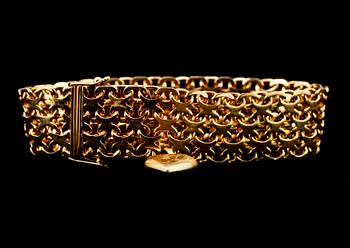ARMBAND, 18k guld, länk med en berlock, Stockholm, 1958. Vikt 40 g.