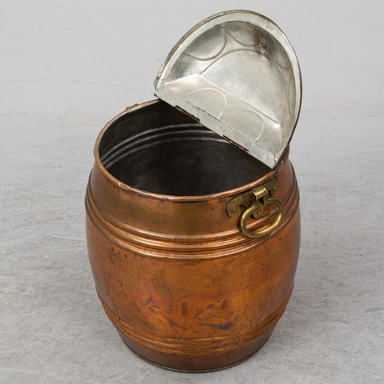 A 19th century copper water barrel.