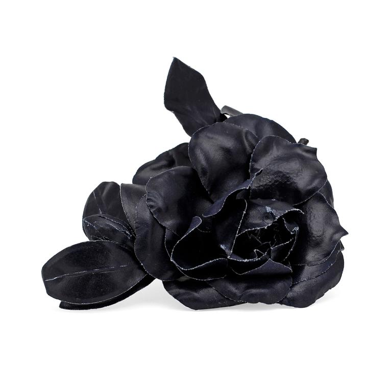 YVES SAINT LAURENT, a dark blue brooch.