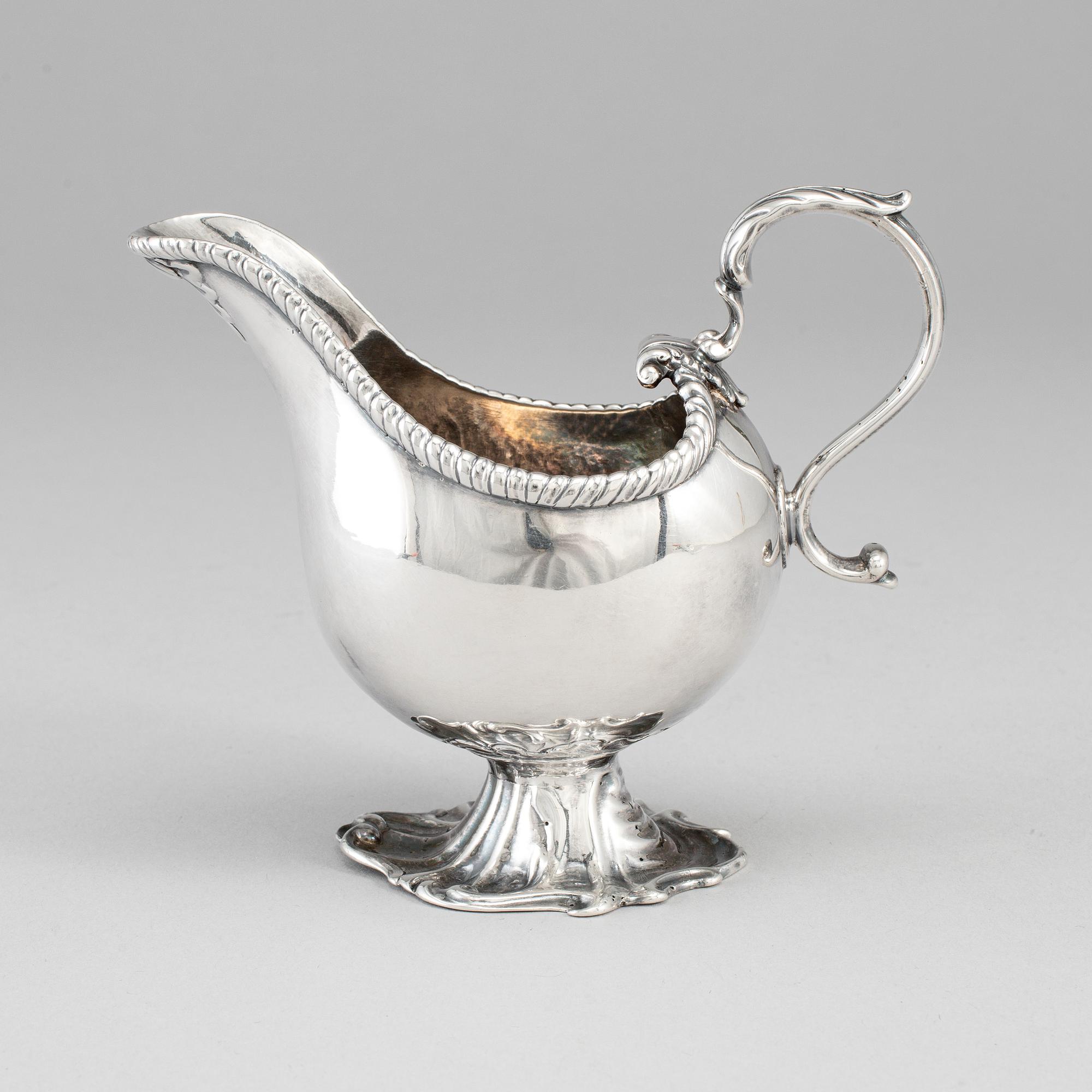 An English 18th century silver sauce-boat, unidentified makers mark, London 1764.