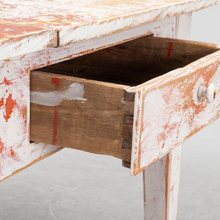 A drop-leaf table, 19th Century.