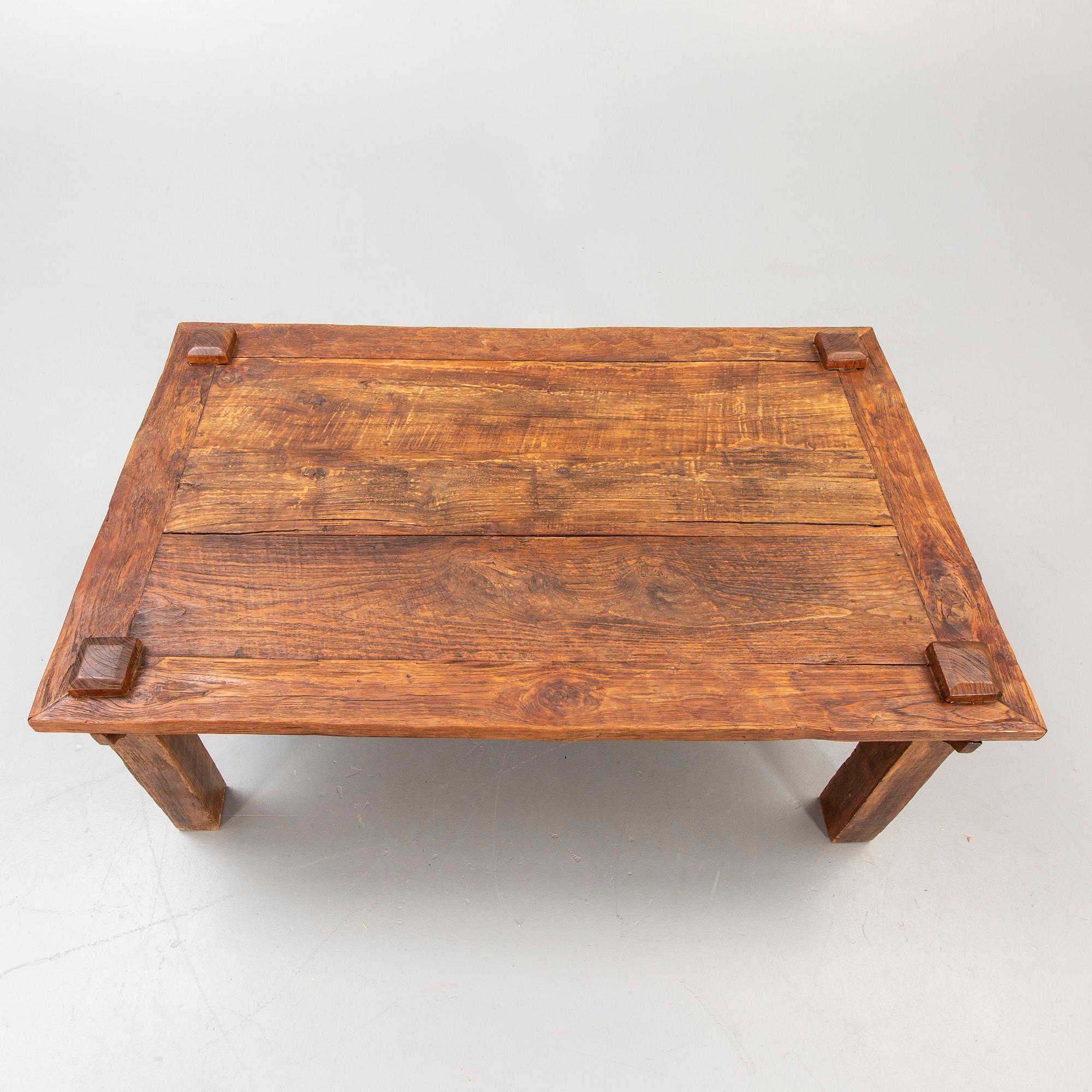 A wooden coffee table later part of the 20th century.
