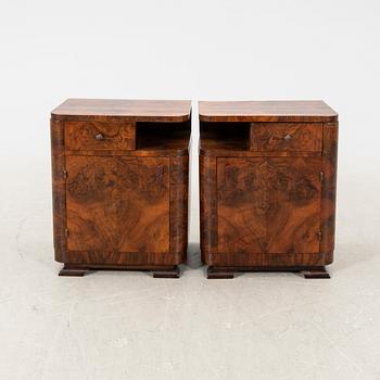 A pair of Art Deco walnut bedside tables.
