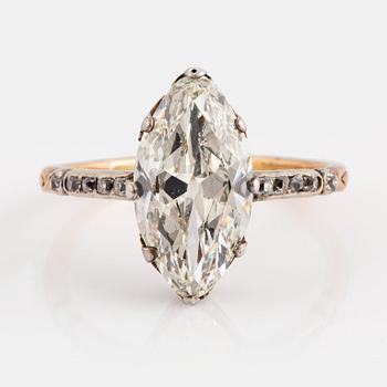 971. A 14K gold and silver ring set with a navette-cut diamond with a total weight of ca 2.75 cts quality ca K vs.