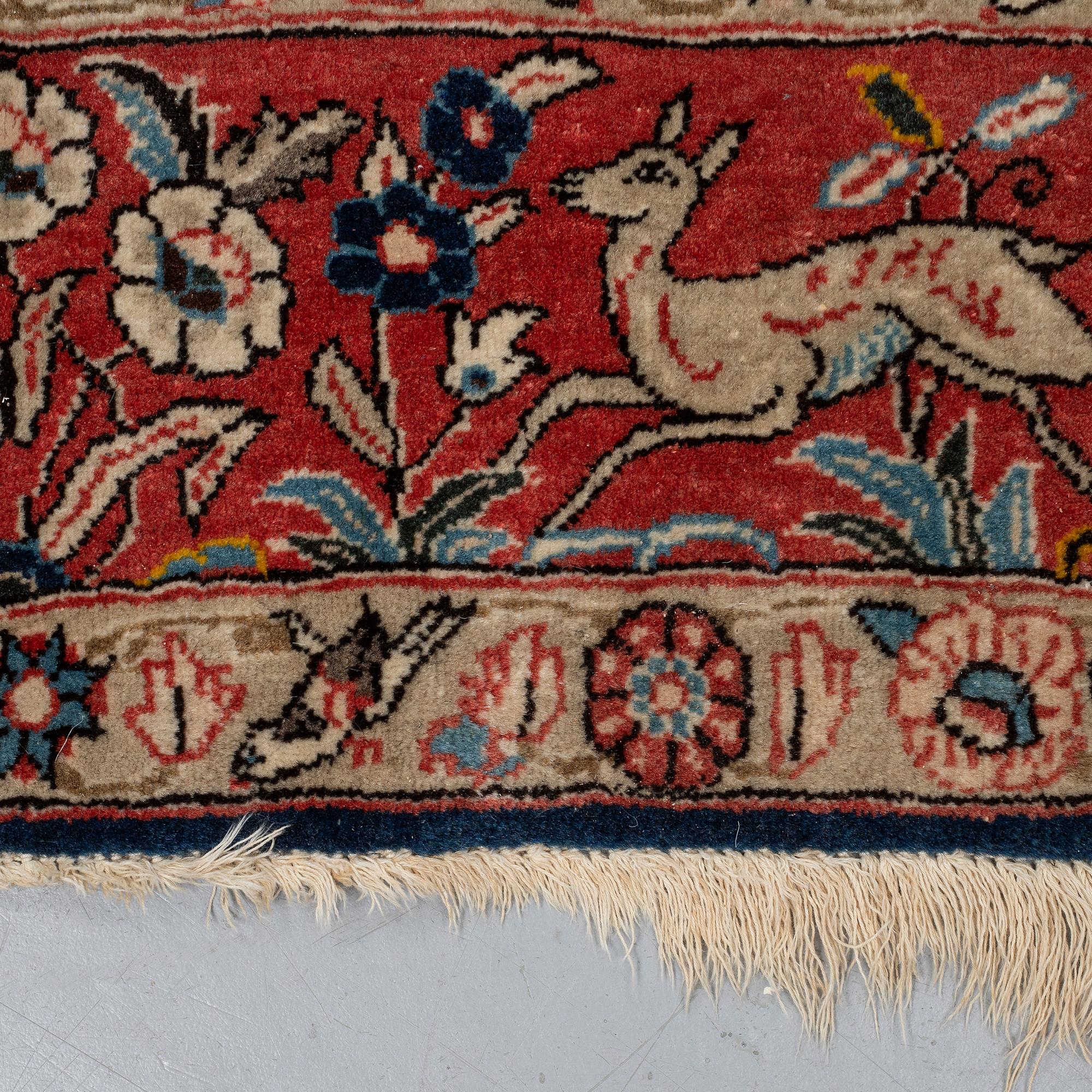 A RUG, an old Qum, figural, Iranian, ca 211-213,5 x 143,5-148 cm.
