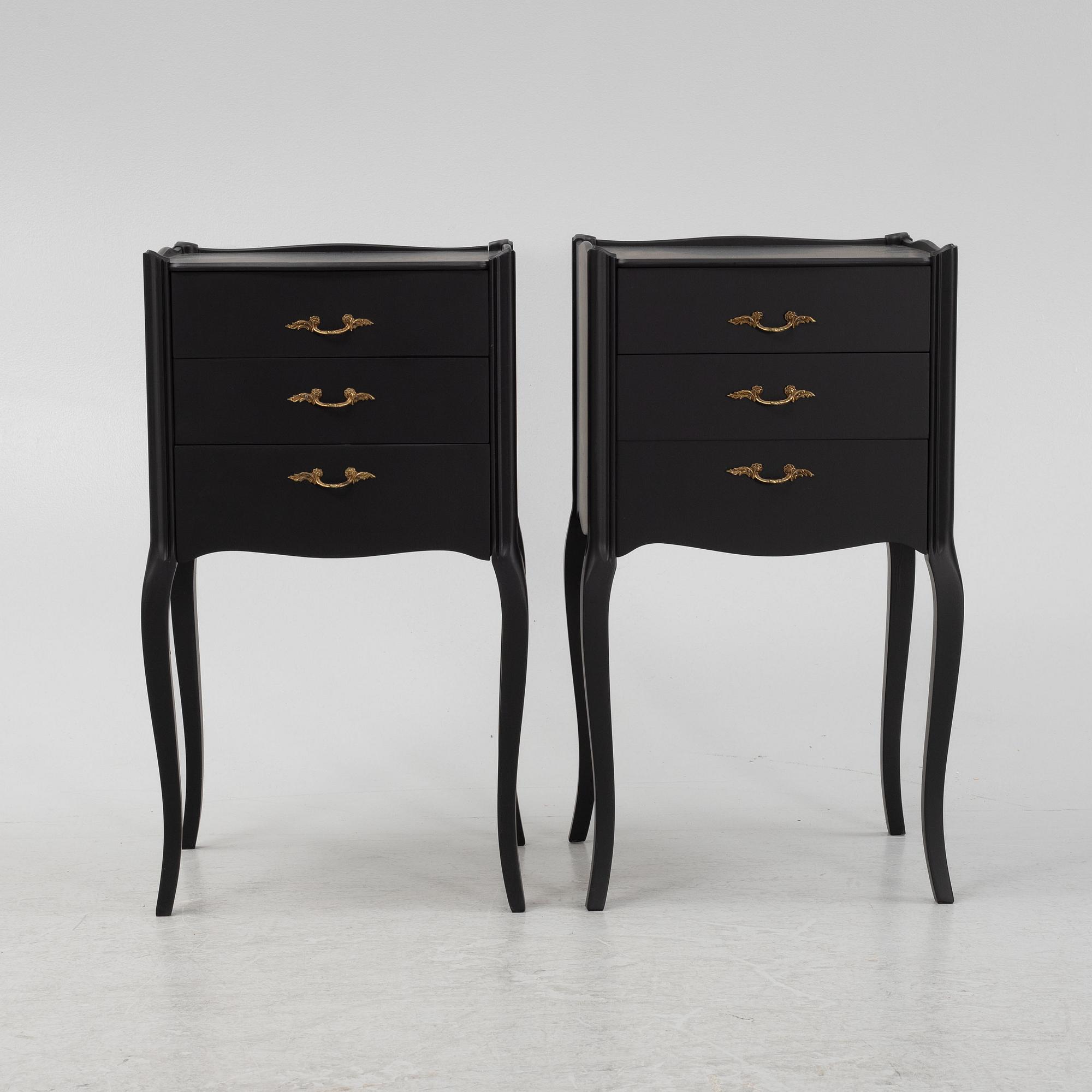 A painted pair of bedside tables.