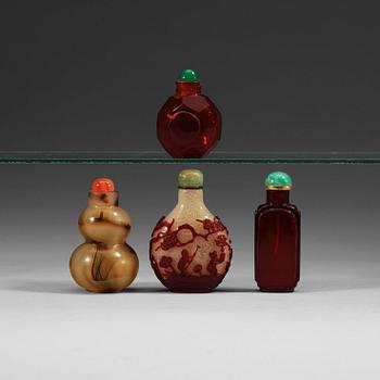 1383. Four Chinese glass snuff bottles, circa 1900.