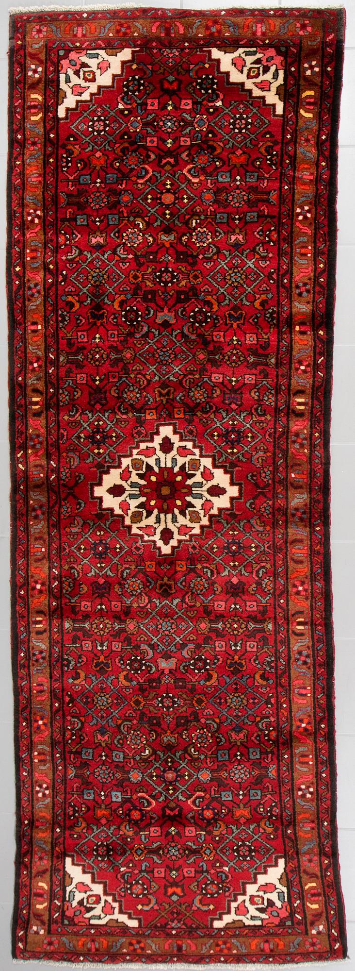 A Hosseinabad runner, 300 x 98 cm.