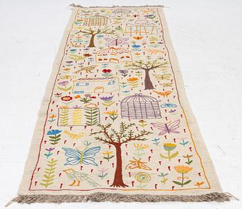 A hand-embroidered kilim runner, c. 300 x 80 cm.