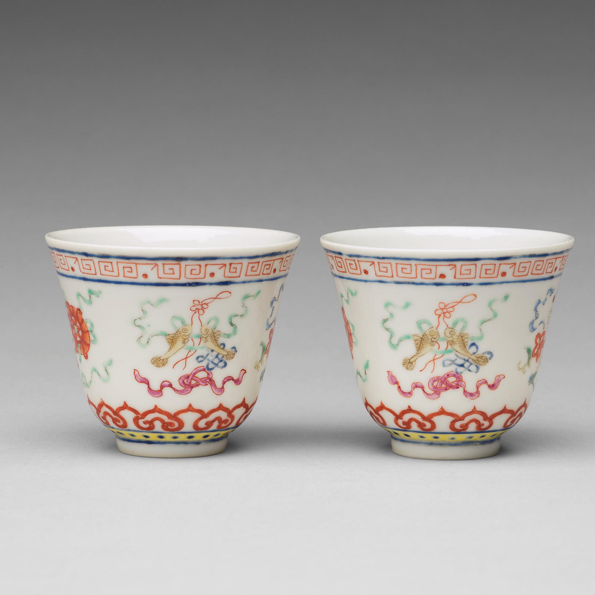 A pair of Chinese famille rose ba jixiang wine cups, Republic, with Guangxu six character mark.