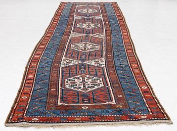 An antique Kurdish runner, probably,. 406 x 105 cm.