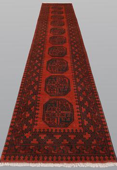 An Afghan runner, ca 383 x 78 cm.