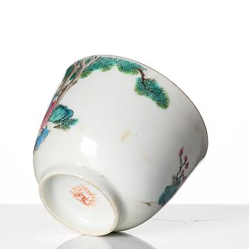 A famille rose 'trick cup' with a little figure, Qing dynasty, 19th Century.