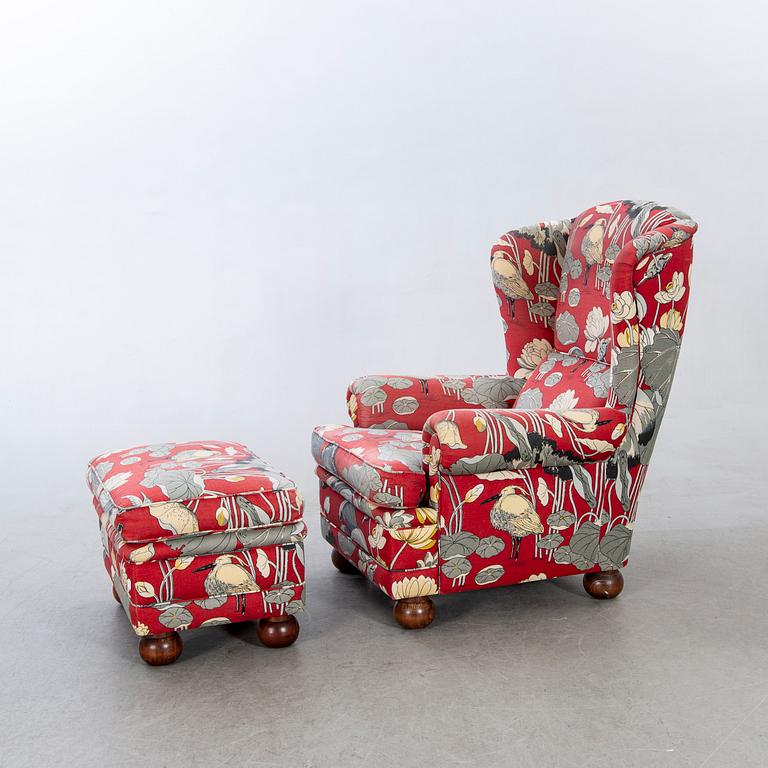 An easy chair with stool later part of the 20th century.