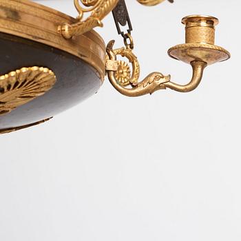 An Empire.style five-branch patinated and gilt bronze chandelier, later part of the 19th century.