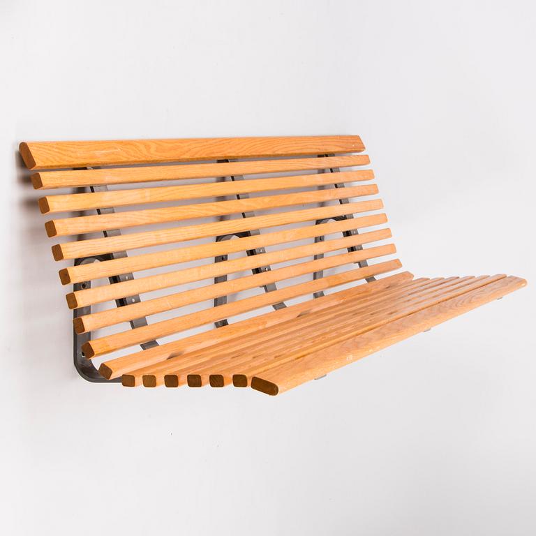 OLLE ANDERSON, A Swedish wall mounted wooden bench manufactured by Nola in the 2000s.