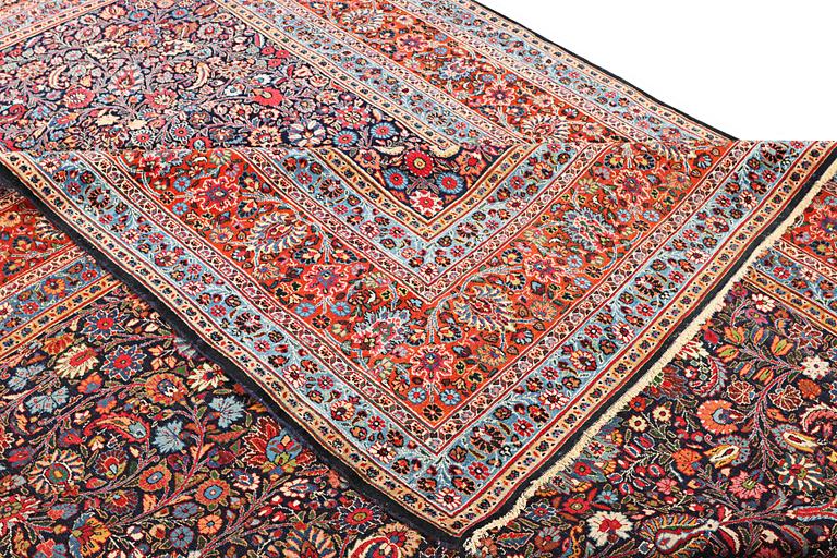 A semi-antique Meshad carpet, a. 360 x 252 cm.
