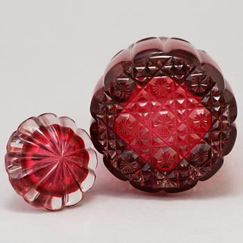 A MID 19TH CENTURY RED GLASS DECANTER AND STOPPER.