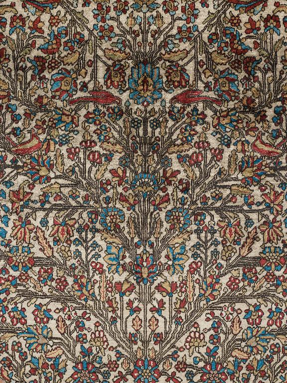 A RUG, an antique silk Kashan, possibly Motachem, ca 208-213,5 x 129,5-132 cm.