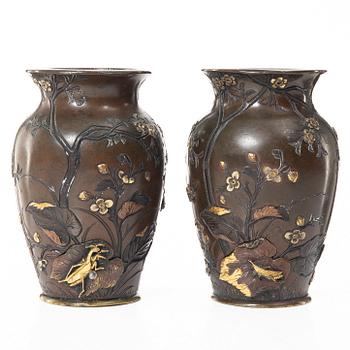 A pair of Japanese metal vases, Meiji (1868-1912).