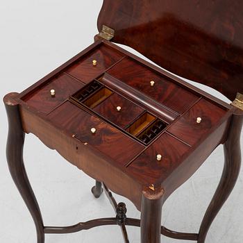 A Rococo style rosewood-veneered and mahogany sewing table, early 20th century.