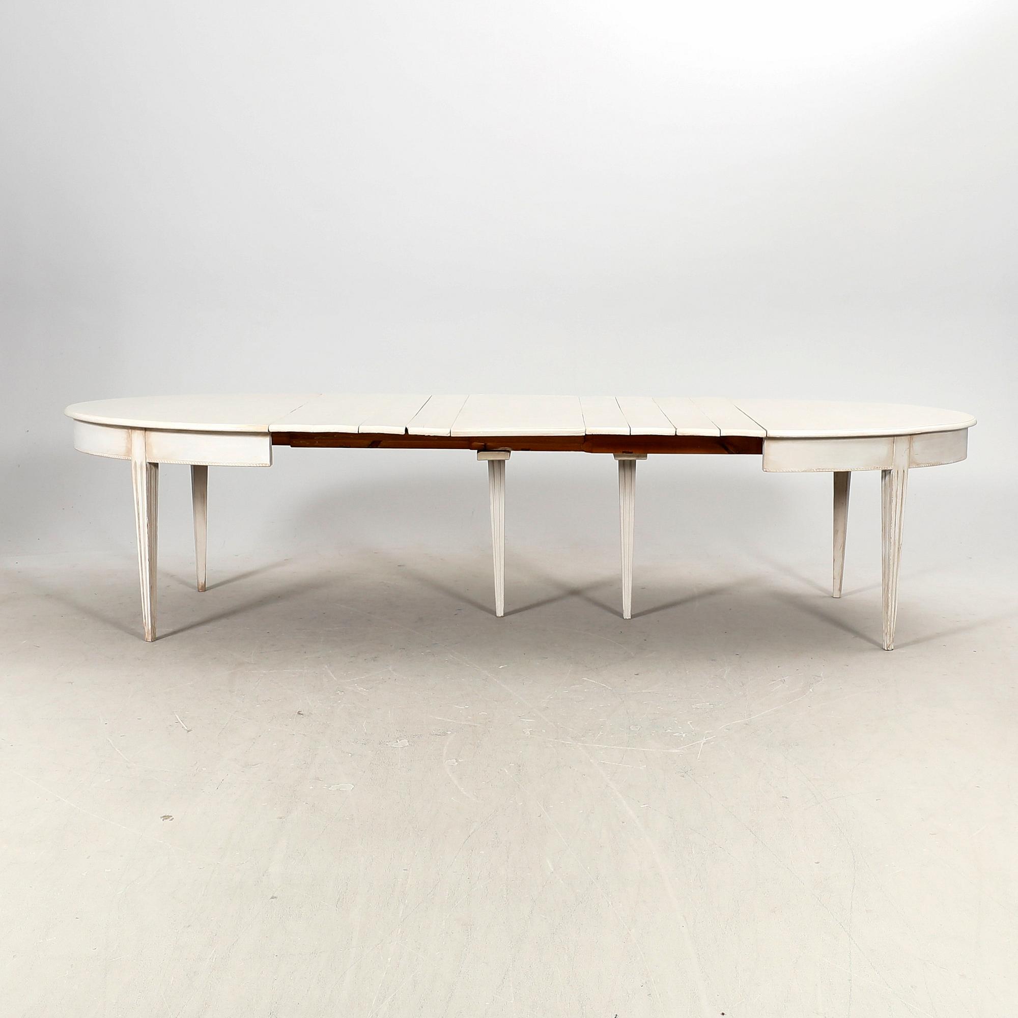 A painted 19th/20th Gustavian style dining table.