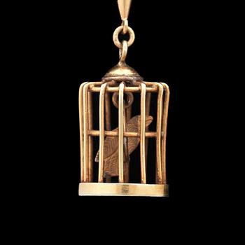 A pair of gold earrings in the shape of bird cages.