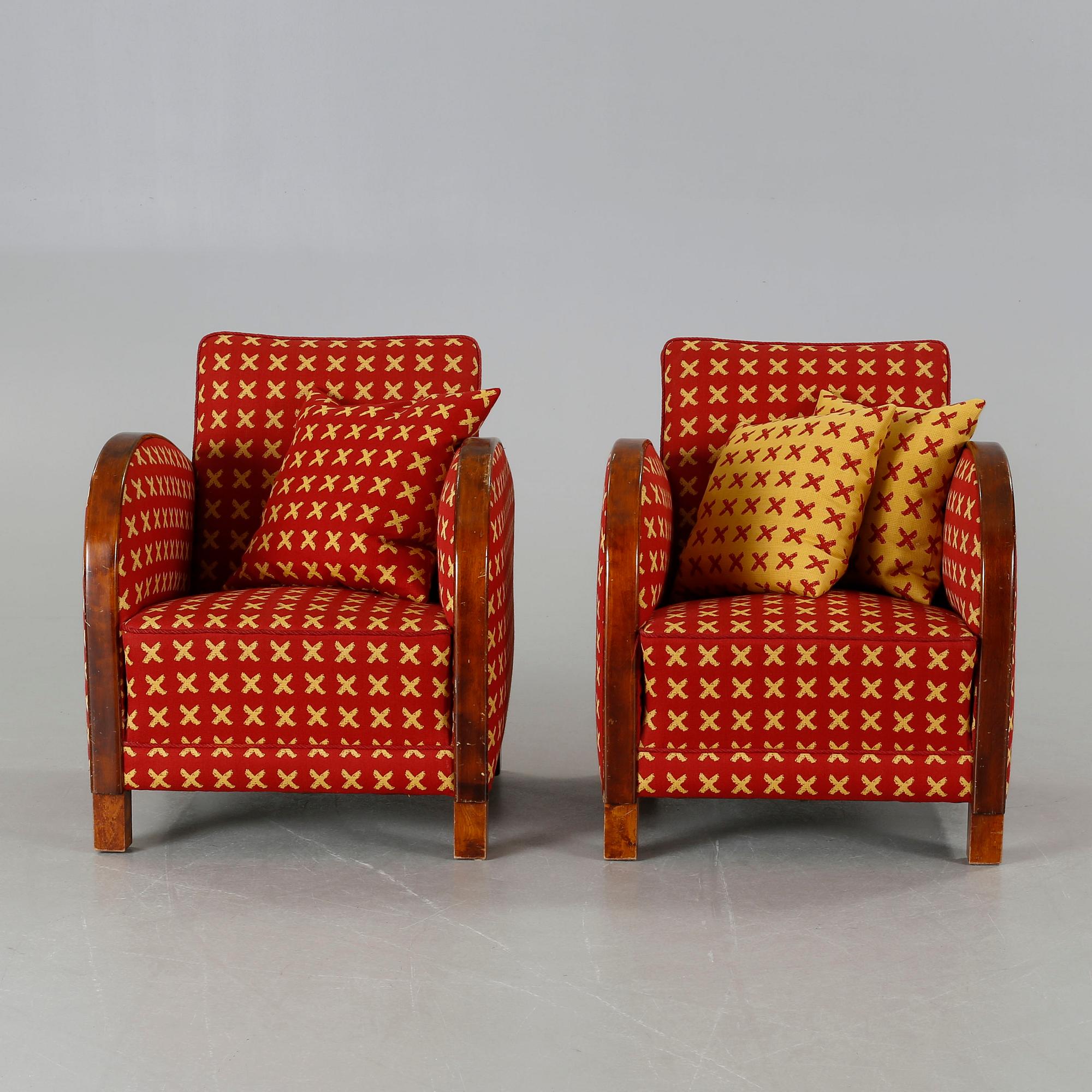 A pair of 1930s armchairs.