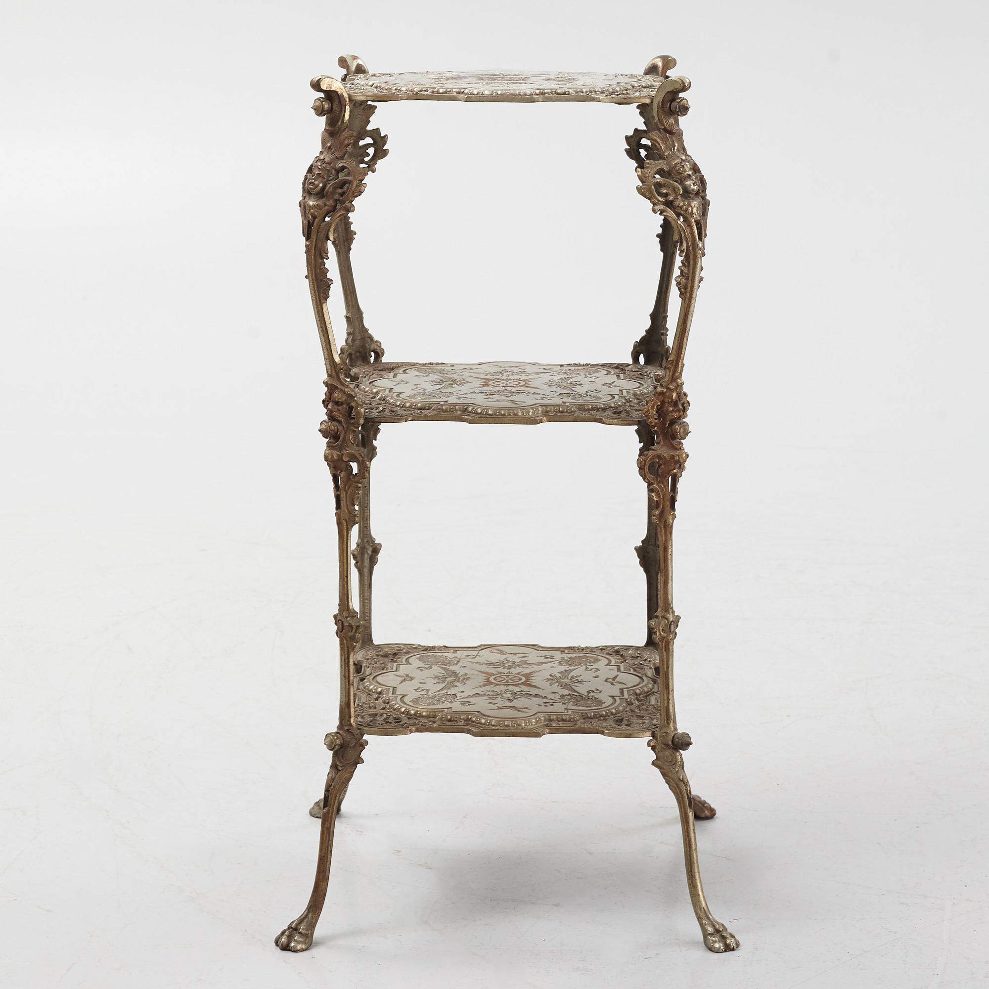 A three-tiered metal pedestal, first half of the 20th century.