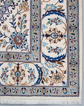 A carpet, Nain, part silk, ca 296 x 192 cm.