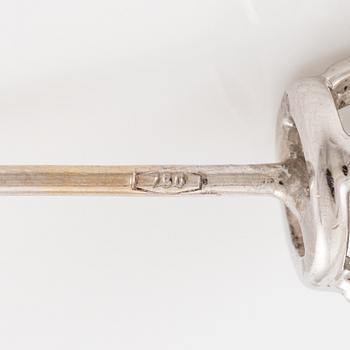 A pair of earrings in 18K white gold set with two round brilliant-cut diamonds, likely Tiffany & Co.